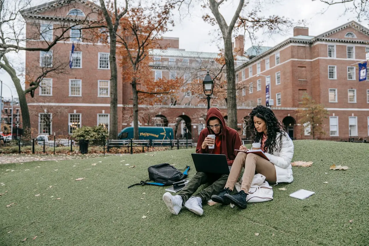 Douglas college scholarship man-and-woman-studying-at-a-park