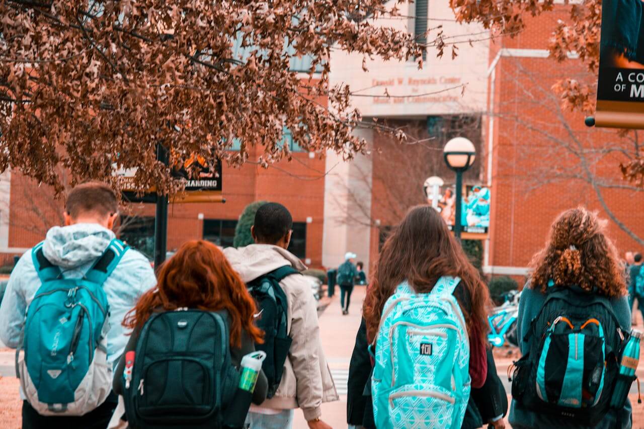 Think Big Postgraduate Scholarship students walking to school with their bags