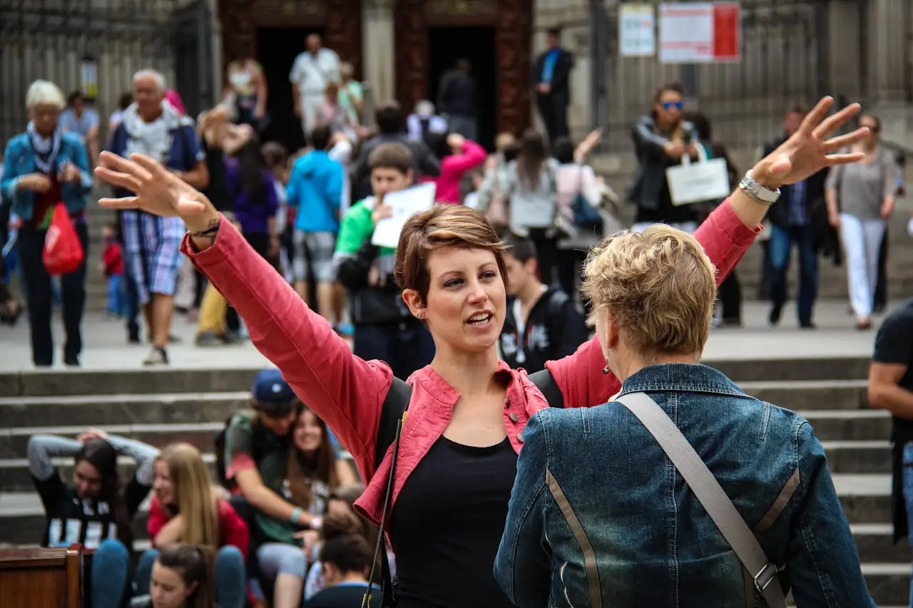 chancellor's international scholarships woman-racing-hands-front-of-another-woman