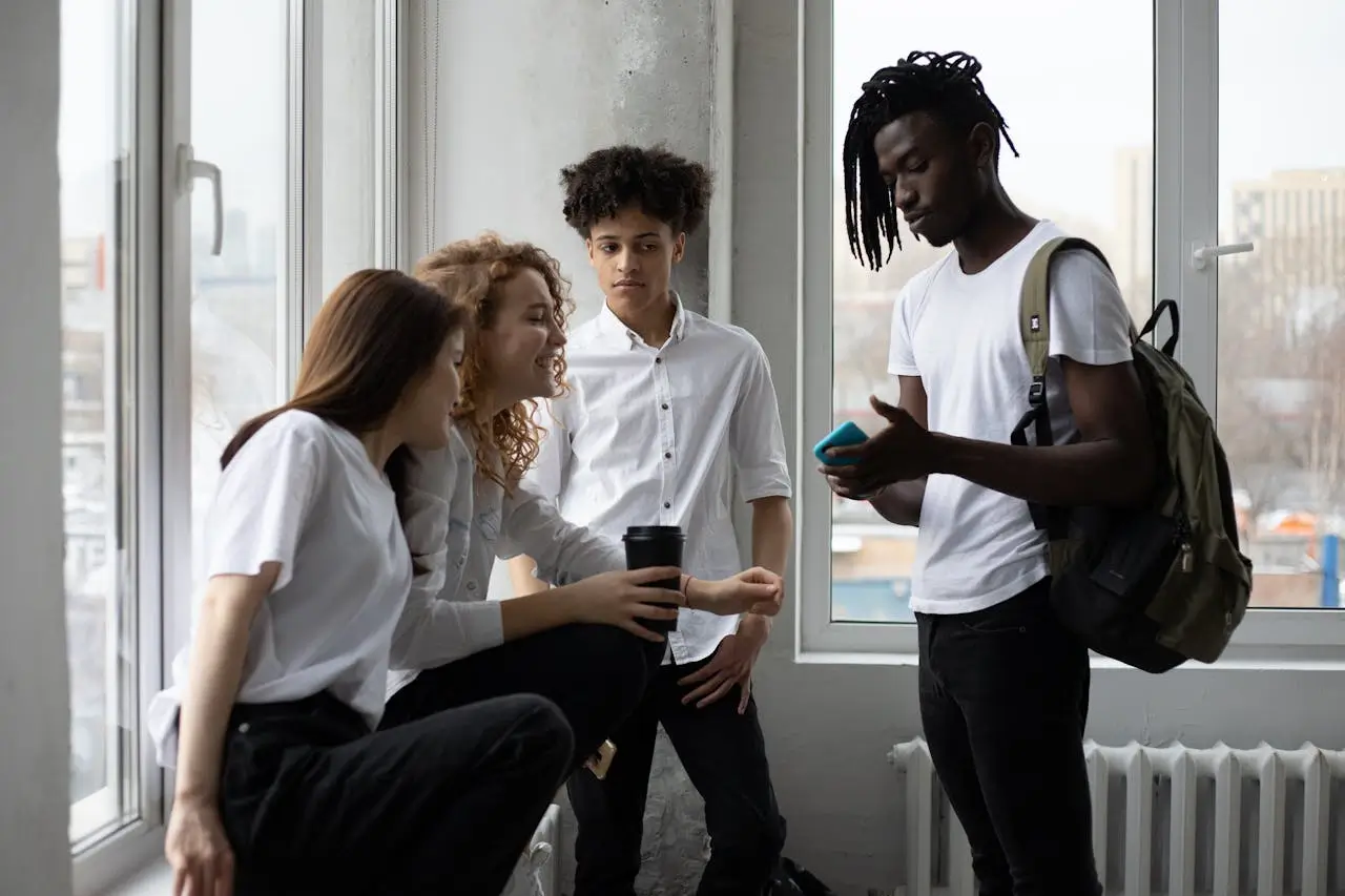 International Scholarship Awards young-diverse-students-chatting-near-window