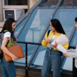 photograph-of-a-group-of friends of the university of auckland scholarship students-talking-with-each-other