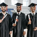 facebook fellowship program men-in-academic-dress-standing-while-holding-diplomat