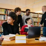 UdeM Exemption International Scholarship group-of-people-sitting-on-chair-in-front-of-table