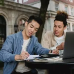 international postgraduate abertay scholarships students-doing-homework-in-team