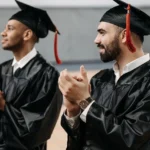 photo-of-scholarship graduate men-clapping-their-hands-